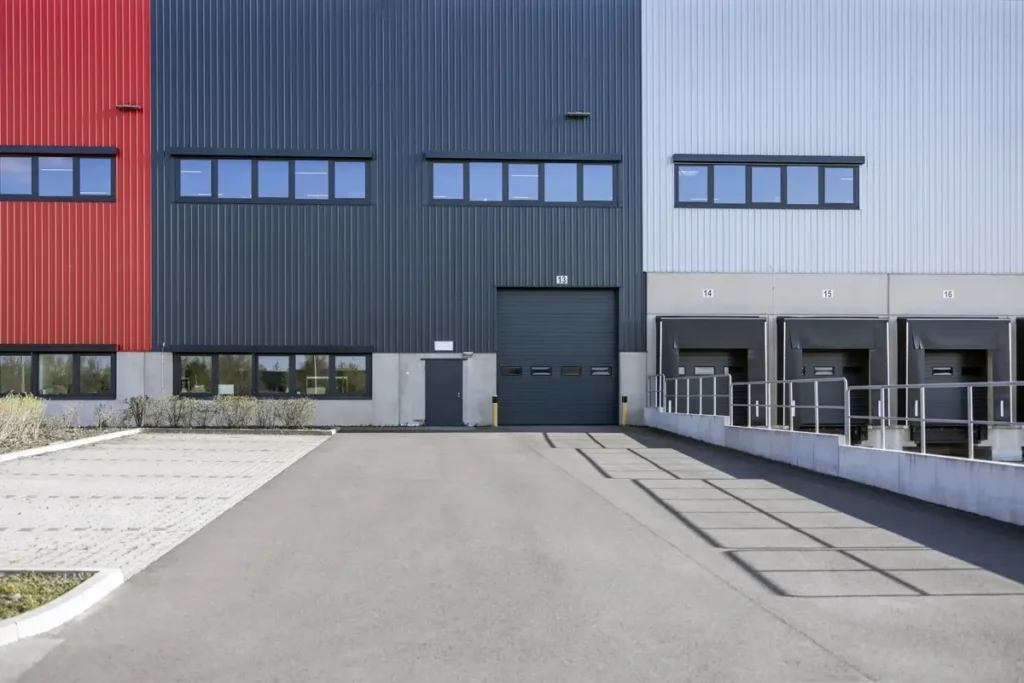 The current image has no alternative text. The file name is: modern-warehouse-and-offices.webp